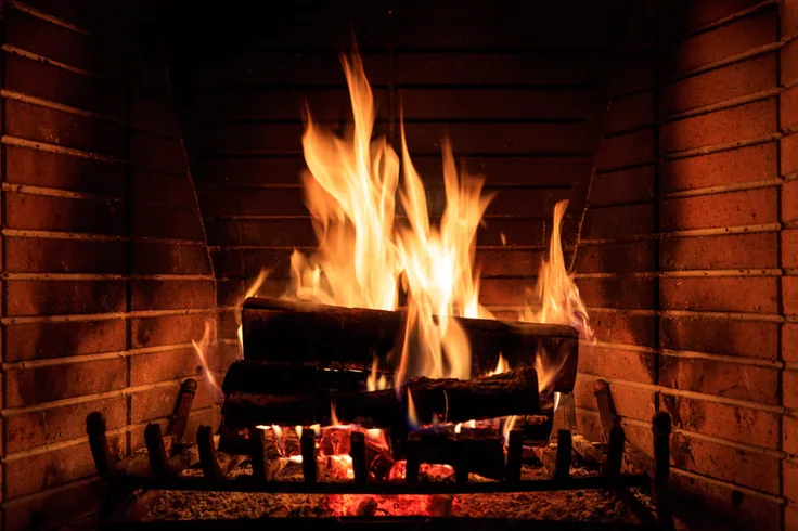 A wood fire burning in a masonry firebox
